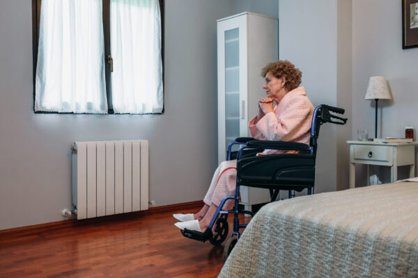 Senior,Woman,Who,Uses,A,Wheelchair,Alone,In,A,Room